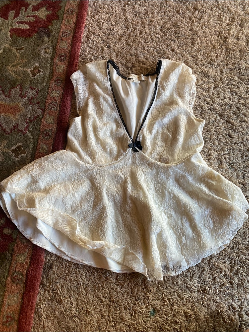 Woman’s ' Cream Lace Peplum shirt with Black Trim
